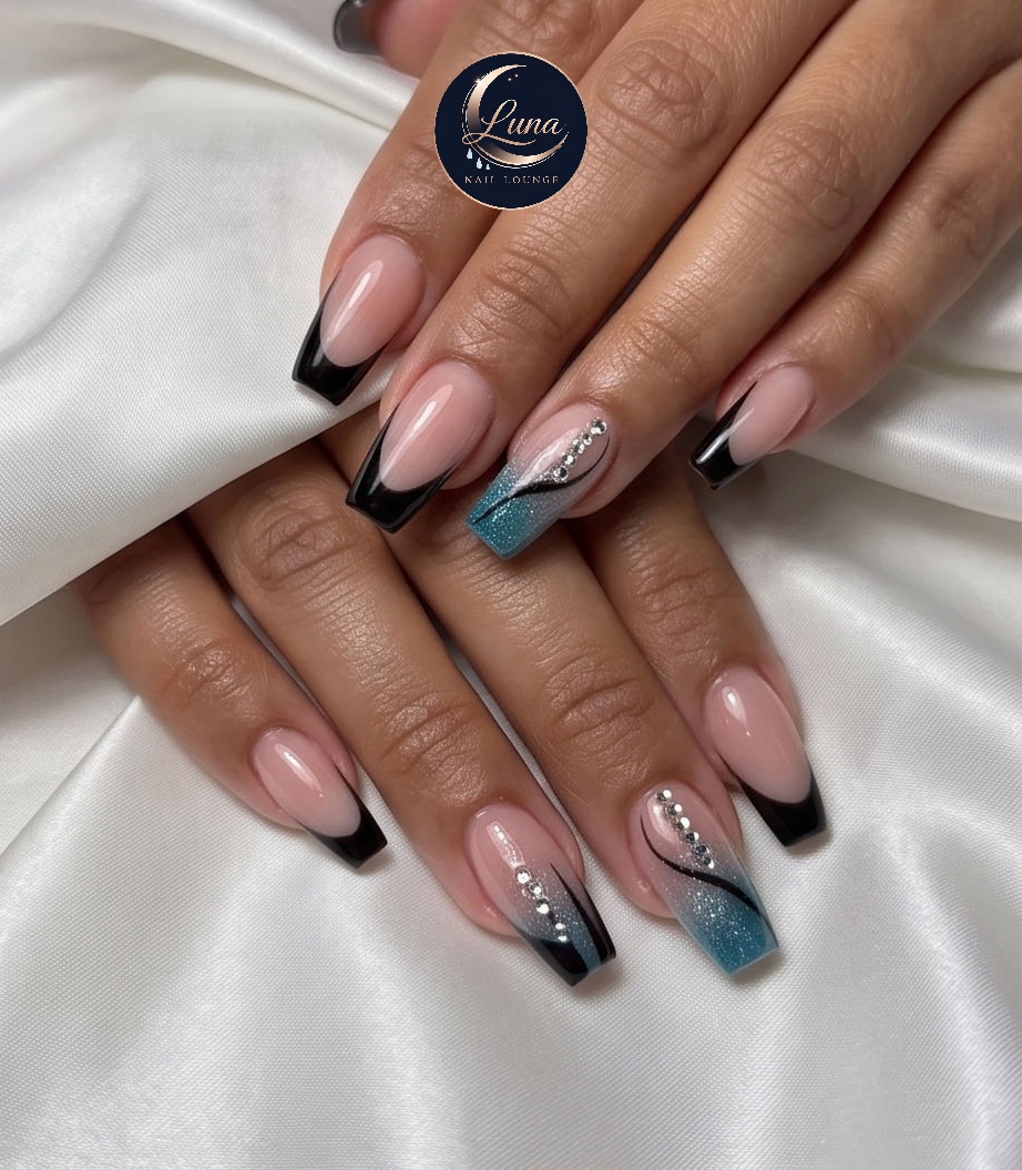 Black French with glitter accents at Luna Nail Lounge